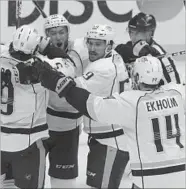  ?? CHRIS CARLSON/AP ?? The Predators celebrate the go-ahead goal by Pontus Aberg against the Ducks during the third period of Game 5.