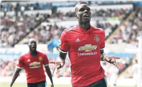  ?? AP ?? Manchester United’s Paul Pogba celebrates scoring his side’s third goal during the English Premier League match against hosts Swansea at the Liberty Stadium in Swansea yesterday.