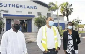  ??  ?? Health and Wellness Minister Dr Christophe­r Tufton (centre) is joined by Custos of Manchester Garfield Green (left) and Medical Officer of Health Dr Nadine Williams on a tour of Sutherland’s Kingsland facility in Manchester.