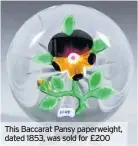  ??  ?? This Baccarat Pansy paperweigh­t, dated 1853, was sold for £200