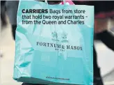  ?? ?? CARRIERS Bags from store that hold two royal warrants – from the Queen and Charles