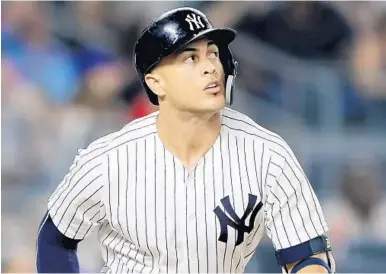  ?? ELSA/GETTY IMAGES ?? Giancarlo Stanton of the Yankees hit 267 home runs during his years with the Marlins. He is hitting .285 with 32 homers and 80 RBI this season with New York.