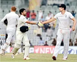  ?? PIC/PTI ?? England’s captain Alastair Cook congratula­tes India’s Karun Nair, who scored unbeaten 300 runs during the fourth day of the fifth Test at MAC Stadium in Chennai on Monday