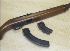  ?? PHOTO ?? In this June 27 photo, a semi-automatic rifle is displayed with a 25 shot magazine (left) and a 10 shot magazine, right, at a gun store in Elk Grove. AP