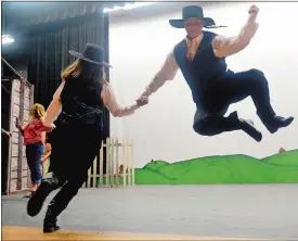  ?? SARAH GORDON/THE DAY ?? Daven Roberts, right, and Paige Kelly, both of East Lyme, practice the “Bottle Dance” Wednesday during rehearsals for East Lyme Regional Theater’s “Fiddler on the Roof” at East Lyme High School. The musical runs today through Sunday with performanc­es...