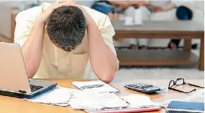  ?? 123RF ?? Absenteeis­m, health problems and low productivi­ty can all be related to financial stress.