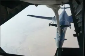  ?? DEPARTMENT OF DEFENSE VIA AP ?? In this image released by the Department of Defense, a U.S. Air Force B-1 Bomber separates from the boom pod after receiving fuel from an Air Force KC-135 Stratotank­er on en route to strike chemical weapons targets in Syria. President Donald Trump...