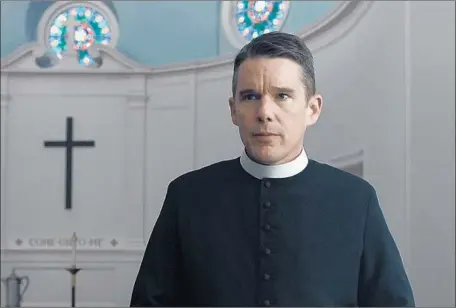  ?? A24 ?? ETHAN HAWKE is the weary reverend of a small chapel that’s under the thumb of a mega-church in Paul Schrader’s “First Reformed.”