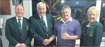  ?? ?? Captain Jimmy Power, president Denny Cole presenting Sean Collins with second prize and lady president Eileen Aherne-O’Connor.