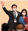  ?? ?? John Lee and his wife Janet CELEBRATE AFTER LEE was NAMED THE City’s new LEADER In Hong Kong on Sunday. — AFP