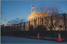  ?? ANNA MONEYMAKER / THE NEW YORK TIMES ?? Recently added security fencing surrounds the U.S. Supreme Court in Washington. As some Republican state lawmakers around the nation work to enact laws making it harder to vote, the Supreme Court will hear its most important election case in almost a decade, one that will determine what sort of judicial scrutiny those restrictio­ns will face.