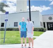  ?? FAA ?? Air Traffic Controller Robert Morgan, left, with Darren Harrison after helping him land a single-engine Cessna safely after an unusual in-flight emergency.