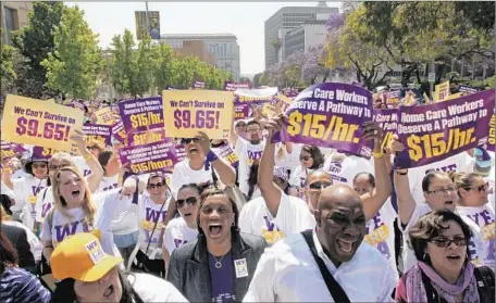  ?? Luis Sinco Los Angeles Times ?? L.A. COUNTY home care workers rally for higher wages in April. Under their current pay, a full-time worker earns about $20,000 a year.