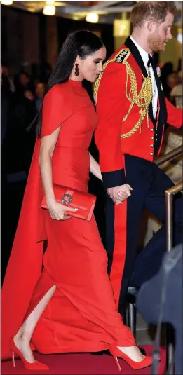  ??  ?? UNIFORM LOOK: Harry and Meghan arrive at Royal Albert Hall last night