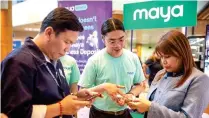  ?? CONTRIBUTE­D PHOTO ?? Maya sets up a booth at the Government Service Insurance System head office in Pasay City on March 18 to assist borrowers in using its platform for loan payments.