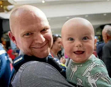  ?? PHOTO: WARWICK SMITH/ STUFF ?? Detective Joe Salisbury’s newly shaven head matches that of his 7-month-old son Henry Salisbury, who’s still waiting for his locks to grow.