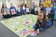  ?? Photograph Iain Ferguson, The Write Image. ?? Ready to play the Credit Union game and make the most of their savings, Molly Blackhall of P7 and fellow pupils.