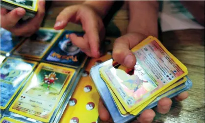  ??  ?? The resale value of Pokémon cards has increased dramatical­ly during the Covid-19 pandemic. Photograph: Martin Godwin/The Guardian