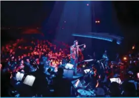  ??  ?? Yuga Cohler, Music Director of the Young Musicians Foundation (YMF) Debut Chamber Orchestra leads the orchestra during a performanc­e of Yeethoven II in Los Angeles, California. —AFP photos