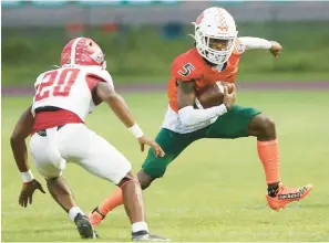  ?? STEPHEN M. DOWELL/ORLANDO SENTINEL ?? Jones High receiver Jabari Smith sidesteps Edgewater defender Jayden Alexander-Felton during their Sept. 16 regular season game, won by the Eagles. Both teams won region semifinals, and they’ll meet again next week in Round 3 of the FHSAA football playoffs.