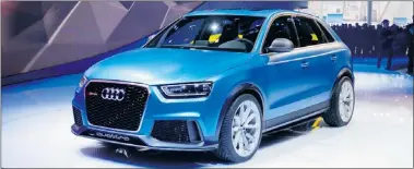  ??  ?? The Audi RS Q3 made its world debut at the show, the bright blue SUV wrapped in a paint job with a slightly yellow tint. It comes with a 2.5 TFSI engine powered by 360 horses and all sorts of other goodies.