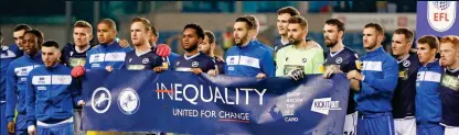  ?? REUTERS ?? Shoulder to shoulder: Millwall and QPR players unite against racism before kick-off