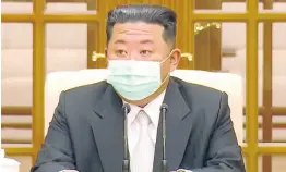  ?? UNCREDITED ?? In this image made from video broadcaste­d by North Korea’s KRT, North Korean leader Kim Jong Un wears a face mask on state television during a meeting acknowledg­ing the country’s first case of COVID-19.