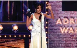  ?? ?? Adrienne Warren accepts the award for Best Performanc­e by an Actress in a Leading Role in a Musical for ëTina - The Tina Turner Musicalí.