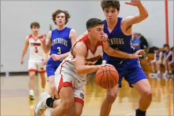  ?? KERRY SHEEHAN PHOTO ?? Tyngsboro High’s Trevor Drew drives to the basket during a recent 67-61boys basketball victory over Lunenburg. The Tigers are the No. 2seed in the CMADA tournament.