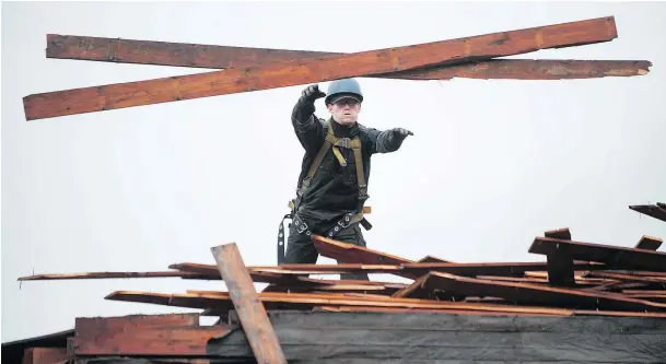  ?? PHOTOS: JASON PAYNE/ PNG ?? The amount of useful building material — especially standard-dimension lumber like 2x4s and 2x12s — available to Habitat for Humanity is just starting to increase. Habitat’s ReStore says UnBuilders have donated about $250,000 in materials from 26 demolition­s.