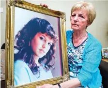  ??  ?? Grief: Marie McCourt with a portrait of Helen