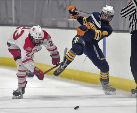  ?? CHRIS CHRISTO — BOSTON HERALD ?? Catholic Memorial’s Brendan Macneil, left, and Xaverian’s Michael Rossi collide as they go for the puck during CM’s 4-0 regular season win at Warrior Arena.