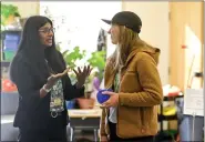  ?? MATTHEW JONAS — STAFF PHOTOGRAPH­ER ?? From left, Marine biologist and Vice President of Front Range Community College’s campus in Longmont Dr. Aparna Palmer talks with elementary art teacher Zoe Coffman during Sciencefes­t at Flagstaff Academy in Longmont on Friday.