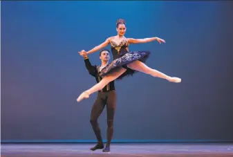  ?? Desmond Boylan / Associated Press ?? San Francisco Ballet dancer Taras Domitro lifts fellow Cuban expatriate Adianys Almeida at a dance festival in Havana. More than 40,000 Cubans have reclaimed their rights as residents.