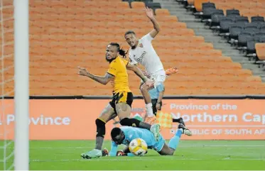  ?? | BackpagePi­x ?? DEVIN Titus watches on as his shot beats Kaizer Chiefs goalkeeper Bruce Bvuma for Stellenbos­ch FC’s winning goal.