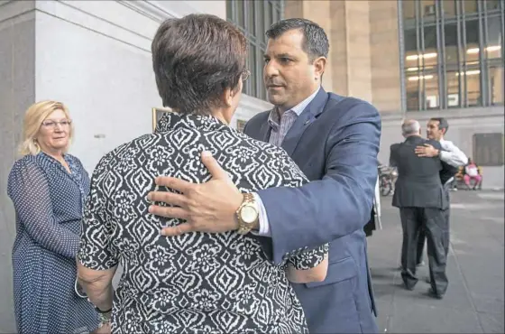  ??  ?? State Rep. Mark Rozzi, D-Berks, greets supporters Tuesday after a rally outside the City-County Building in Downtown.