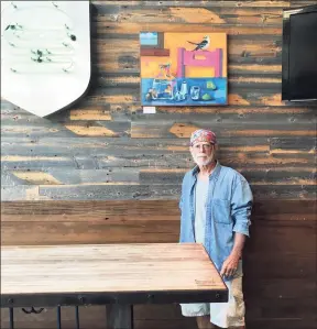 ?? Rick Senft / Contribute­d photo ?? WALL ART: Artist Rick Senft stands by his exhibit of artwork at Shake Shack in New Haven, which will be up through early December, he says. Senft has been associated with the Gilded Lily gallery in Milford the past 19 years.