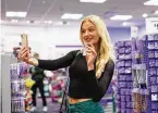  ?? NICK SCHNELLE/ THE NEW YORK TIMES ?? Mary Clare Lacke, a University of Missouri student and one of four new Tiktok “college creators” working as interns for Claire’s, a teen accessorie­s company, at a Claire’s store in Columbia, Missouri, Feb. 6.