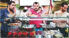  ?? Twitter ?? A Syrian chef prepares Iftar at the busy Bab Al Hara Restaurant in Cairo.