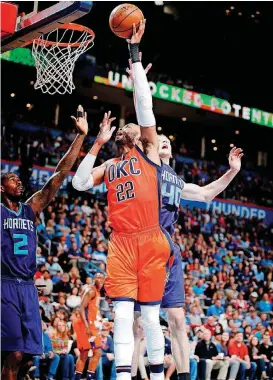  ?? [PHOTO BY SARAH PHIPPS, THE OKLAHOMAN] ?? Oklahoma City’s Taj Gibson goes up for a basket during Sunday’s game against Charlotte at Chesapeake Energy Arena. Gibson returned to the lineup after missing Friday’s loss to San Antonio with an illness.