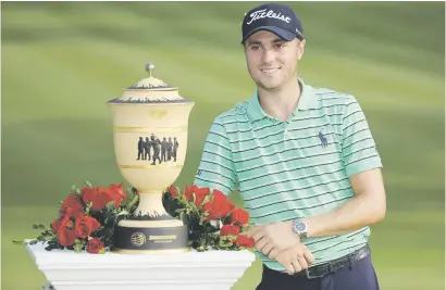  ?? Picture: AFP ?? BIG DAY. Justin Thomas with the Gary Player Cup after winning the WGC Bridgeston­e Invitation­al at the Firestone Country Club in Akron, Ohio on Sunday.