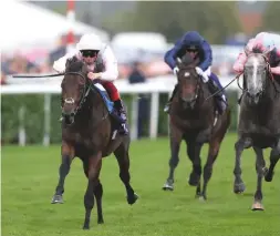  ??  ?? Too Darn Hot (Frankie Dettori) heads the Champagne Stakes