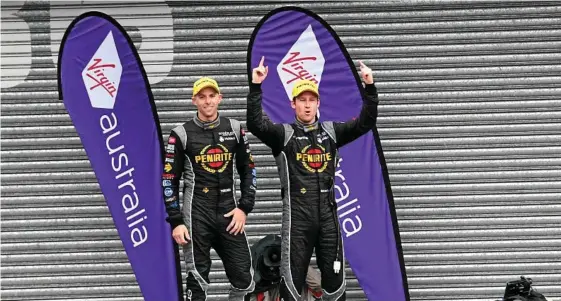  ?? PHOTO: BRENDAN ESPOSITO/AAP ?? SPORTING TRIUMPH: V8 Supercar driver David Reynolds (right) celebrates with co-driver Luke Youlden after winning the Bathurst 1000 at Mount Panorama, Bathurst, last Sunday.