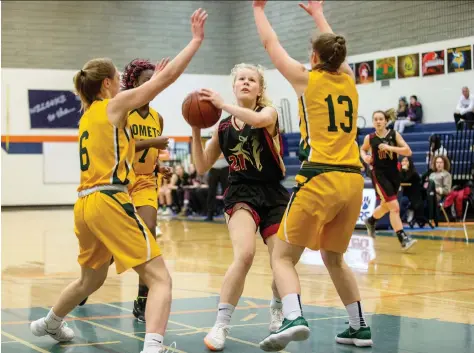  ?? LIAM RICHARDS ?? Emerson Pekush of Saskatoon’s Centennial Collegiate Mustangs lines up a shot against the Melfort Comets during tournament action earlier this season. The Comets will be shooting for a three-peat in the 4A girls competitio­n while the Mustangs will be chasing 5A girls honours.