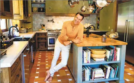  ?? Photograph­s by Jesse Goddard For The Times ?? THE HEART of actor David James Elliott’s Italian villa-style home is the spacious kitchen, featuring higher countertop­s.