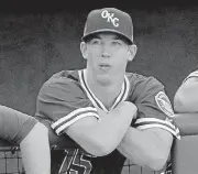  ?? OKLAHOMAN] [PHOTO BY STEVE GOOCH, THE ?? Oklahoma City Dodgers pitcher Walker Buehler watches from the dugout during Monday’s game vs. Memphis at Chickasaw Bricktown Ballpark. Buehler was recently promoted from Double-A Tulsa.