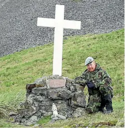  ??  ?? Andy Pender at the Ernest Shackleton monument at Grytviken, Cumberland Bay East, Antartica. Shackleton was a merchant navy officer and Antarctic explorer in the early 1900s.