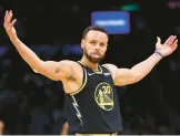  ?? ELSA/GETTY ?? Warriors’ Stephen Curry celebrates in the third quarter of Friday’s Game 4 matchup against the Celtics at TD Garden in Boston, Massachuse­tts.