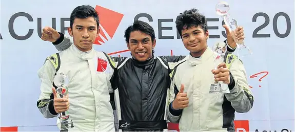  ??  ?? WINNERS: Anhika Sasabone, Shayur Harpal and Arjun Maini on the podium at the 2013 Formula BMW Asia Cup series in Malaysia in June