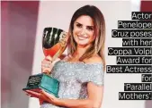  ??  ?? Actor Penelope Cruz poses with her Coppa Volpi Award for Best Actress for ‘Parallel Mothers’.